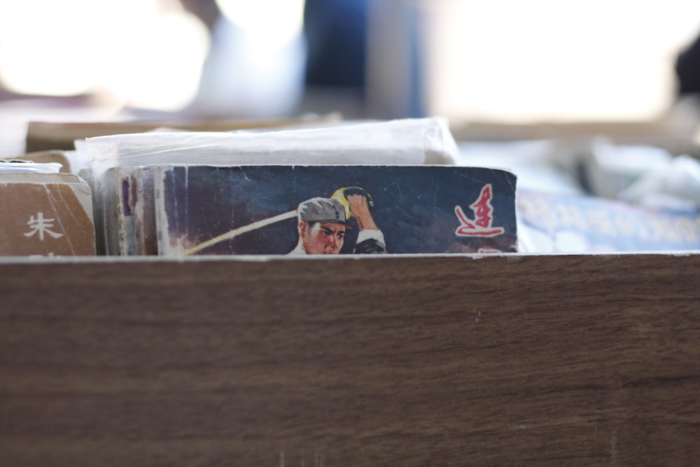 a close up of a wooden box filled with business cards