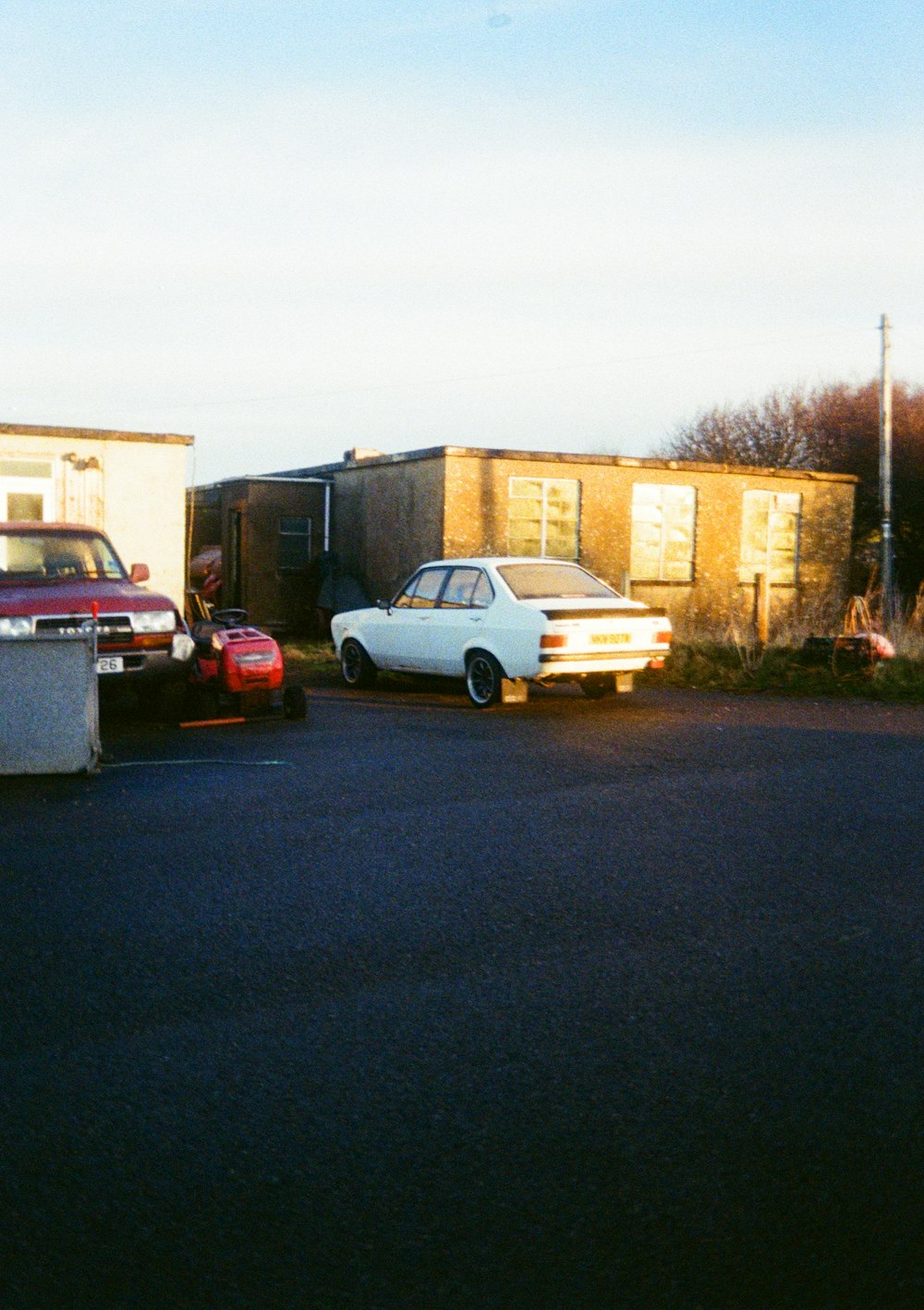 a couple of cars parked in a parking lot