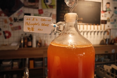 a bottle of liquid sitting on top of a counter