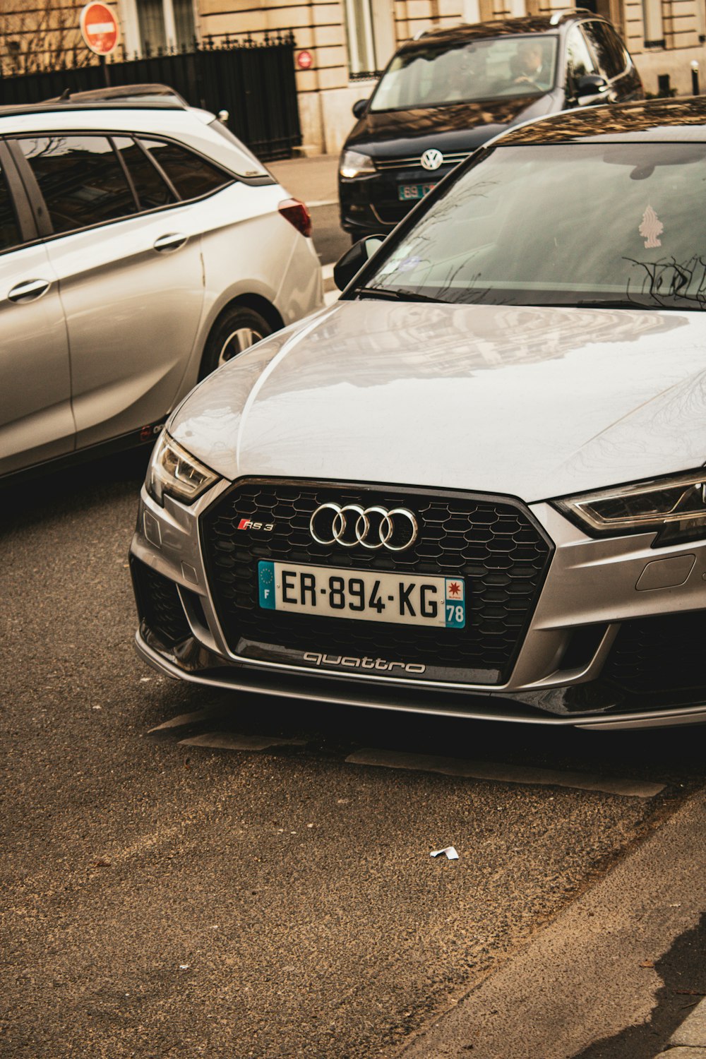 a silver car parked on the side of the road