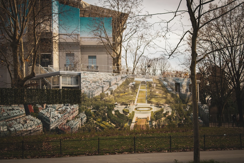 a mural of a park in front of a building