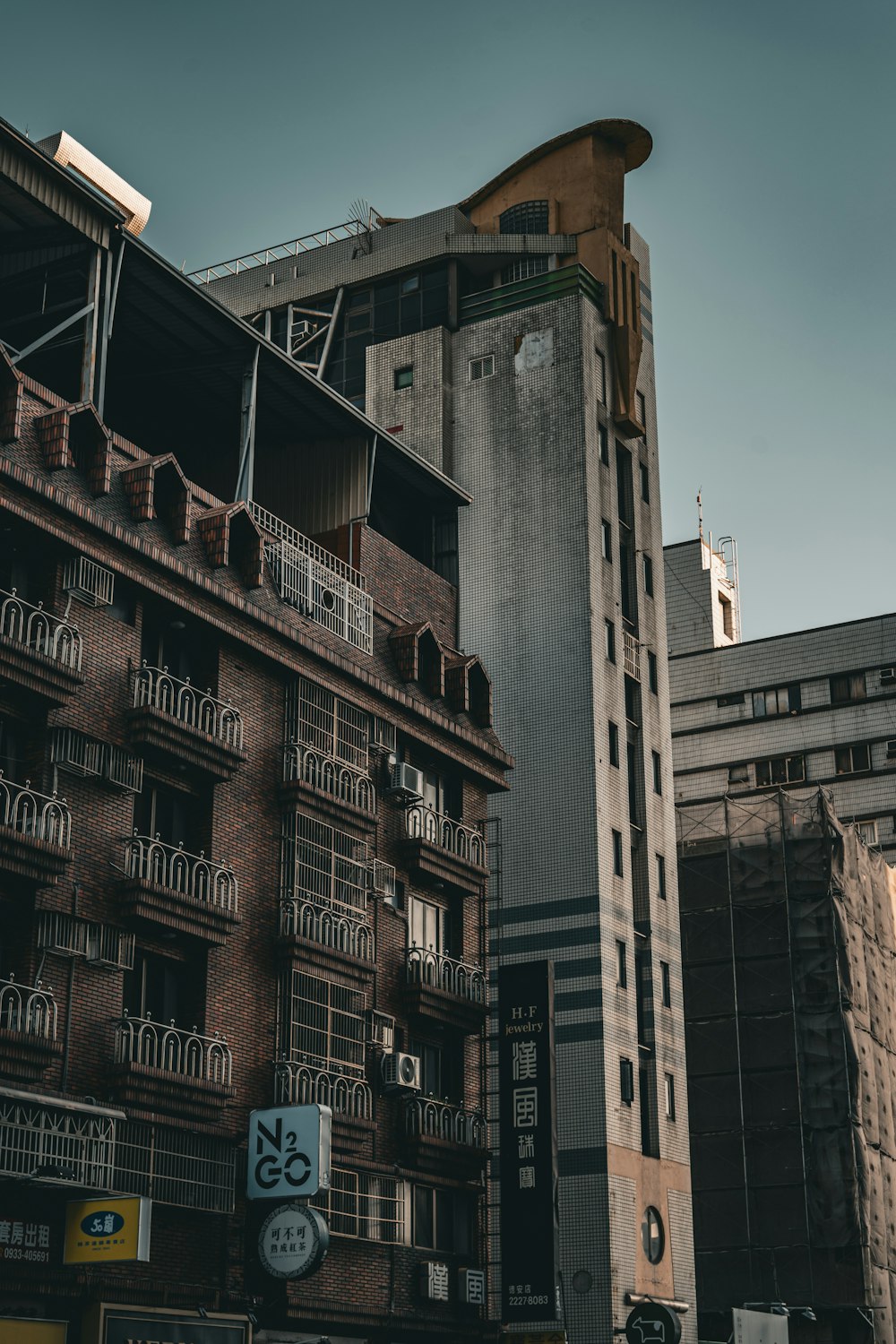 a tall building with a clock on the side of it