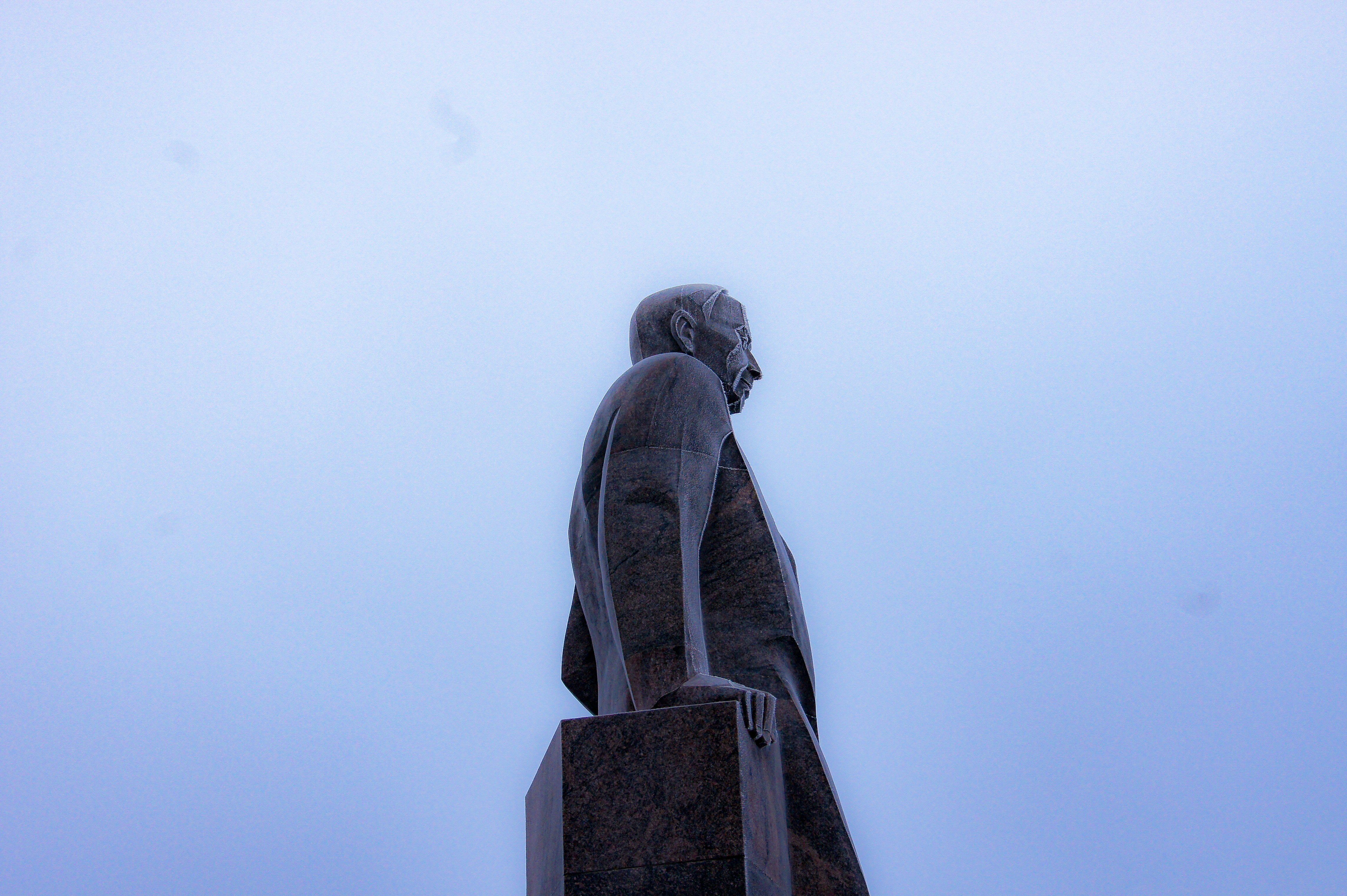 a statue of a man with his hands in his pockets