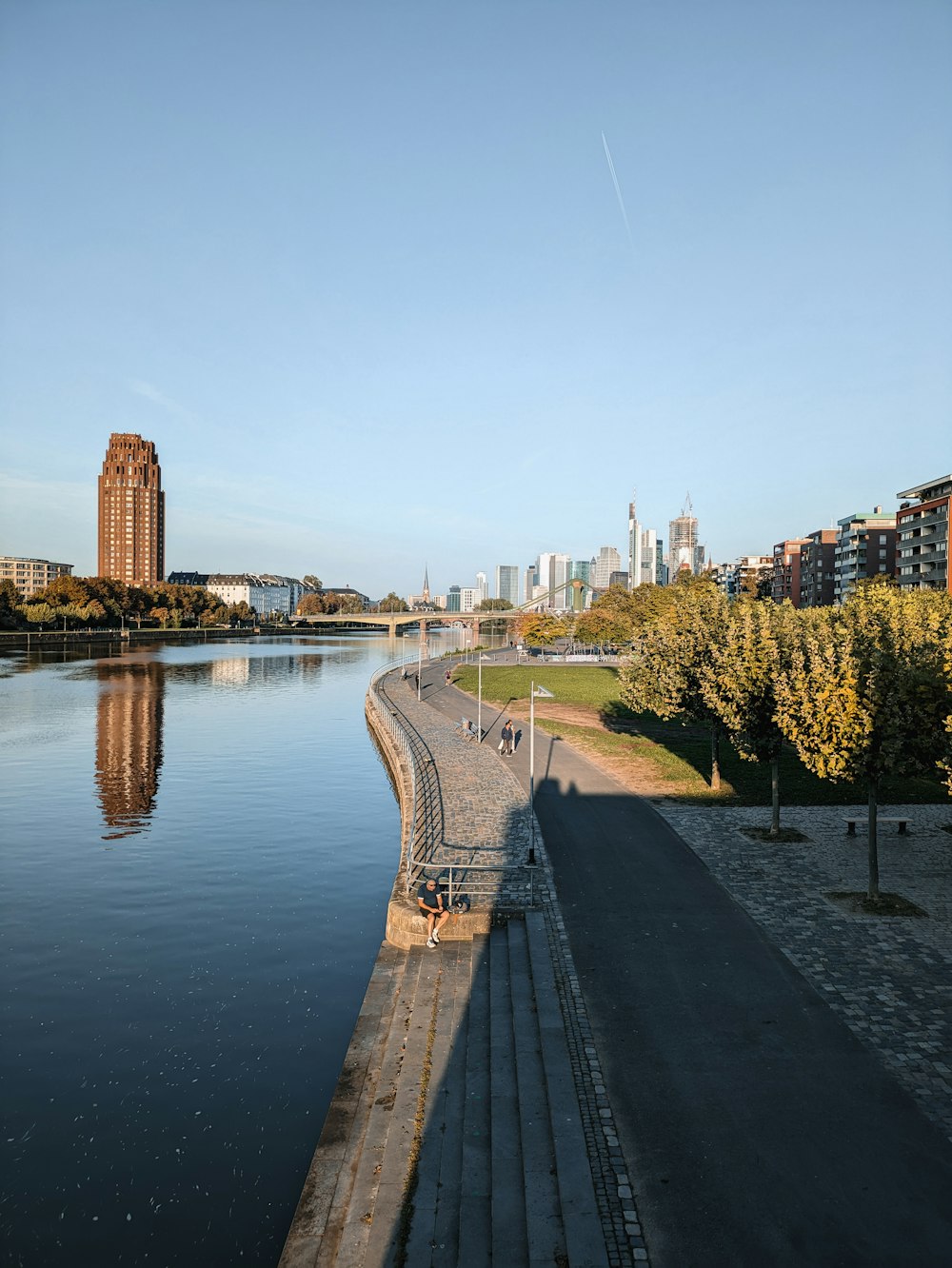 a body of water with a city in the background