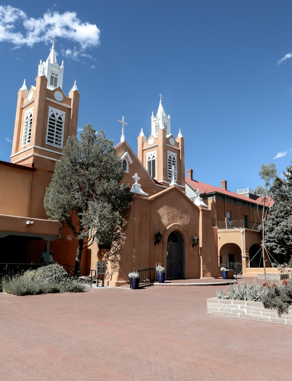 a large church with two towers and a clock tower