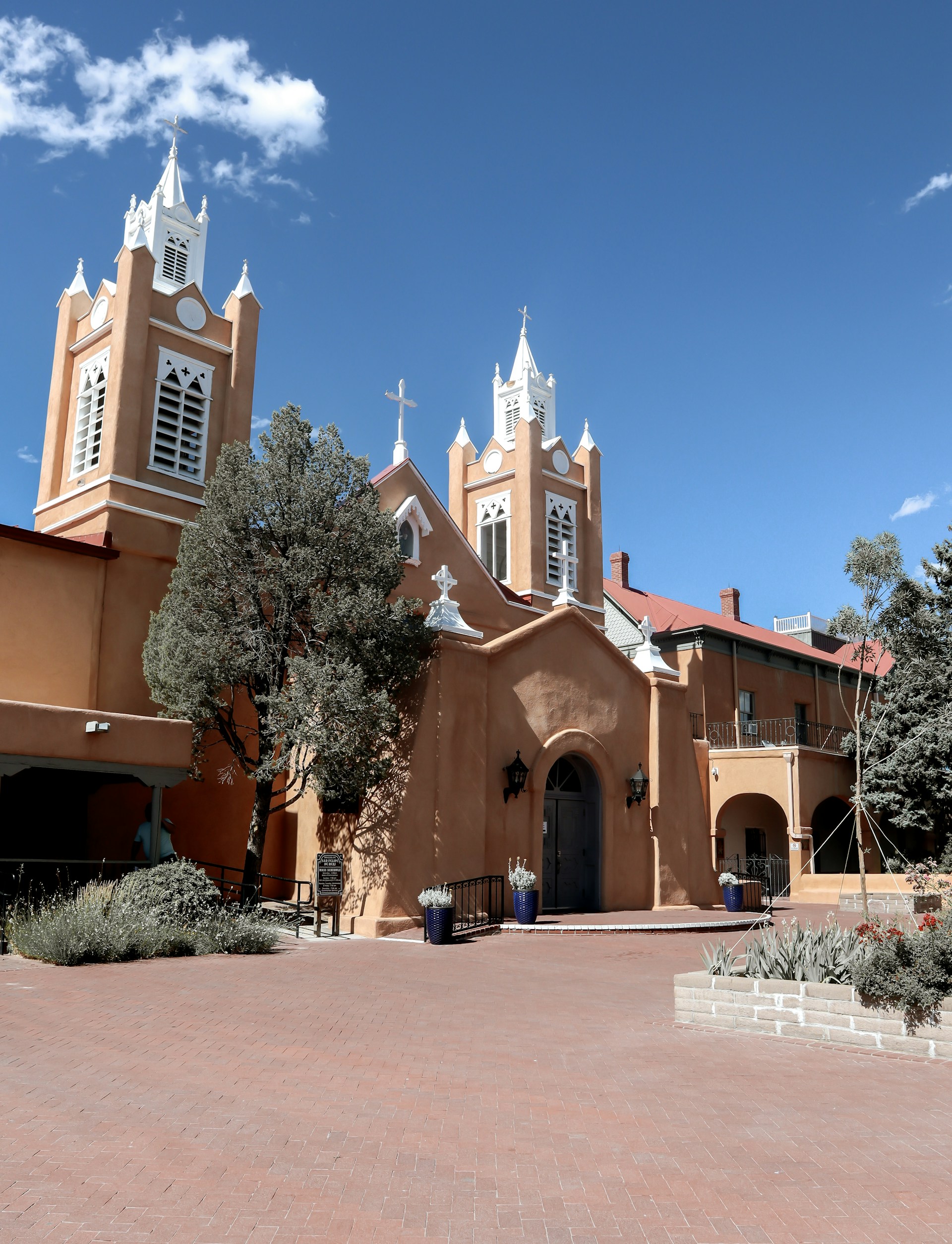 a large church with two towers and a clock tower