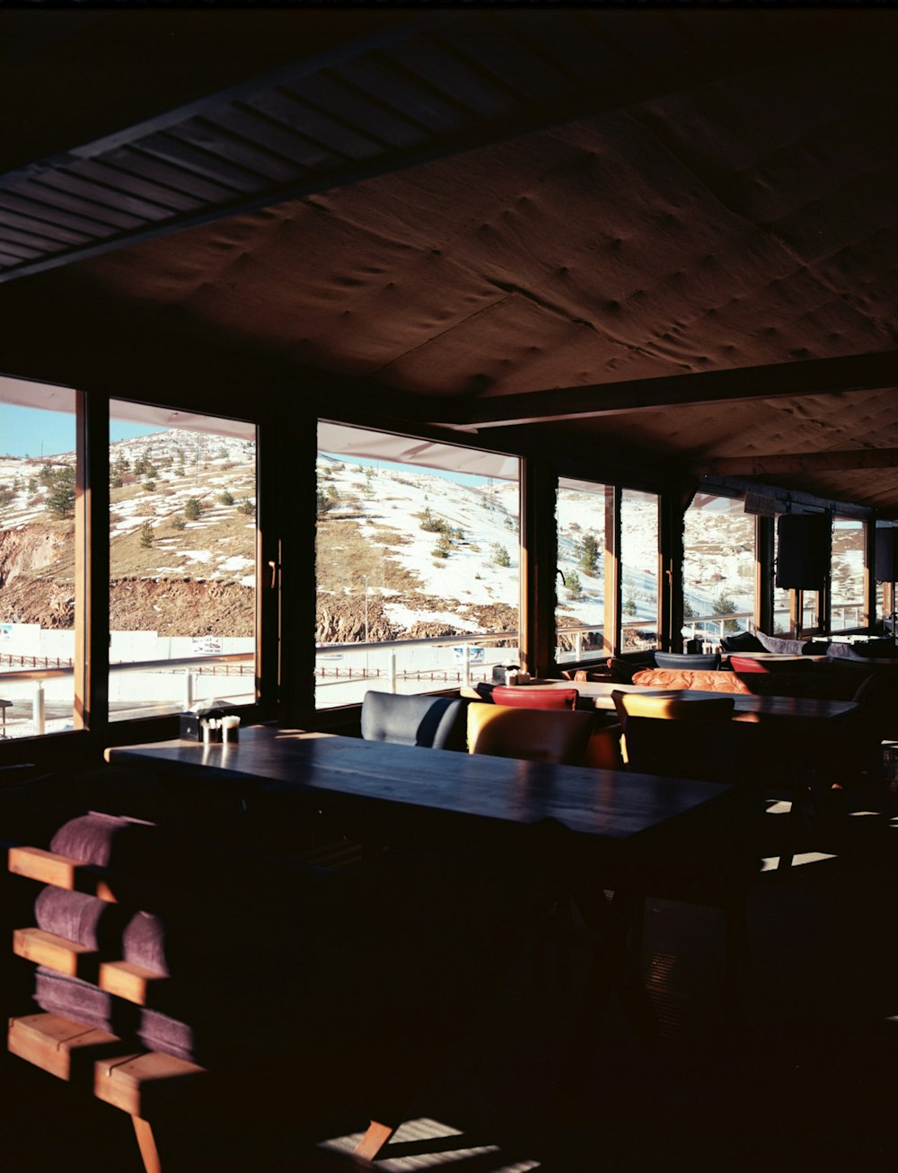 a restaurant with a view of a snowy mountain