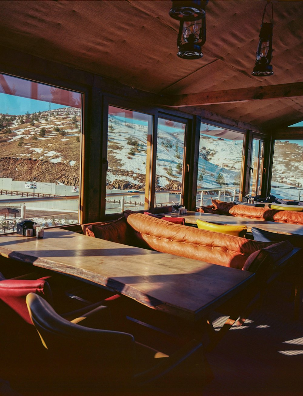 a restaurant with a view of a snowy mountain