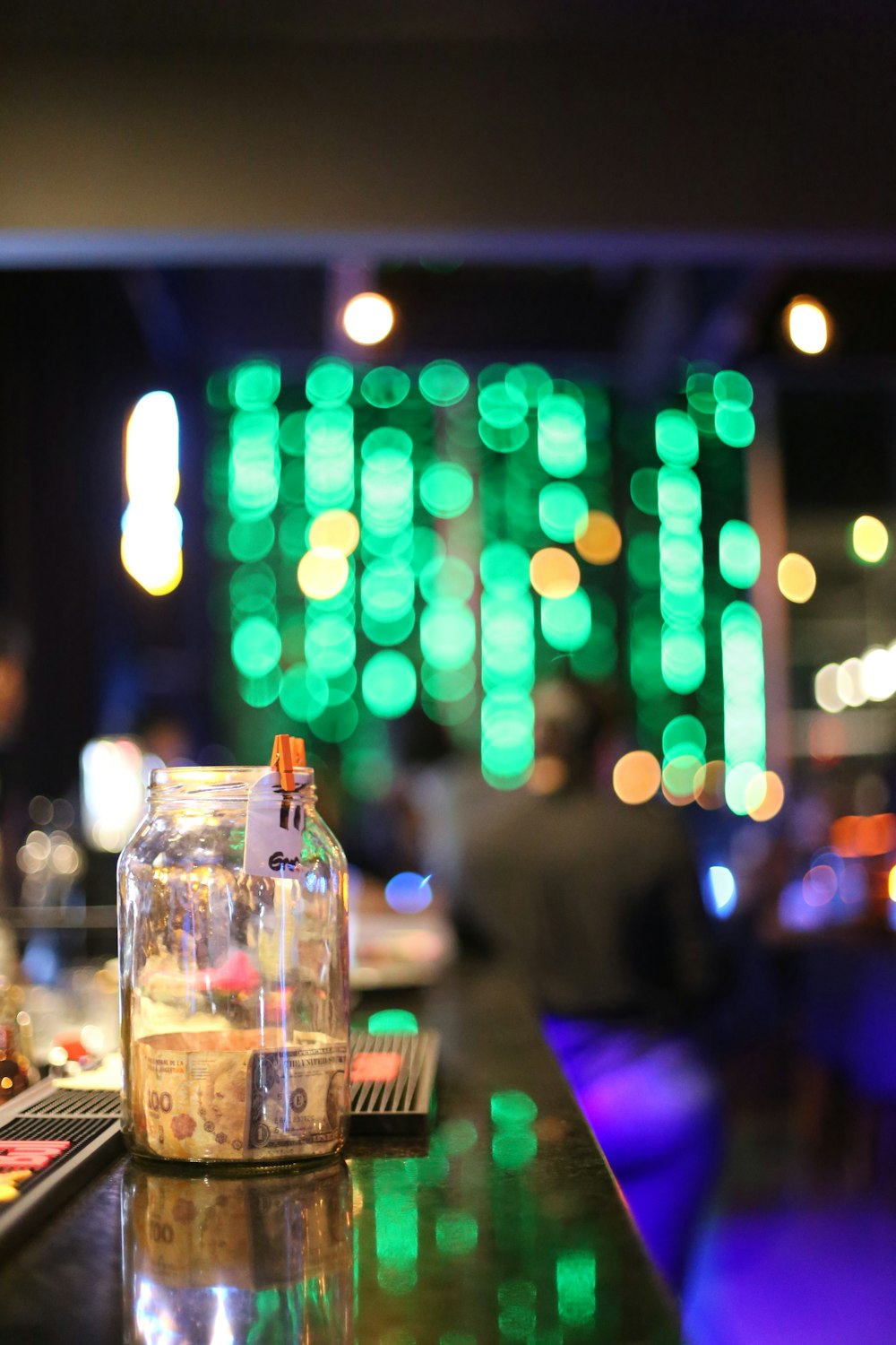 a bottle of liquor sitting on top of a bar