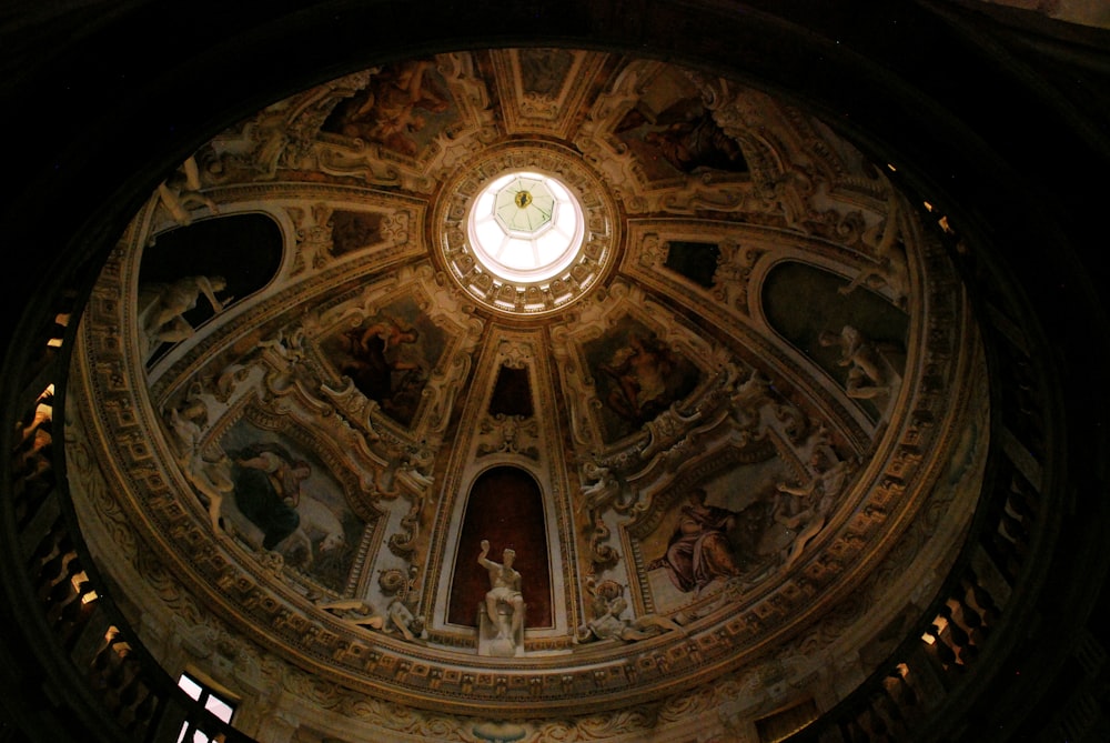 the ceiling of a church with paintings on it