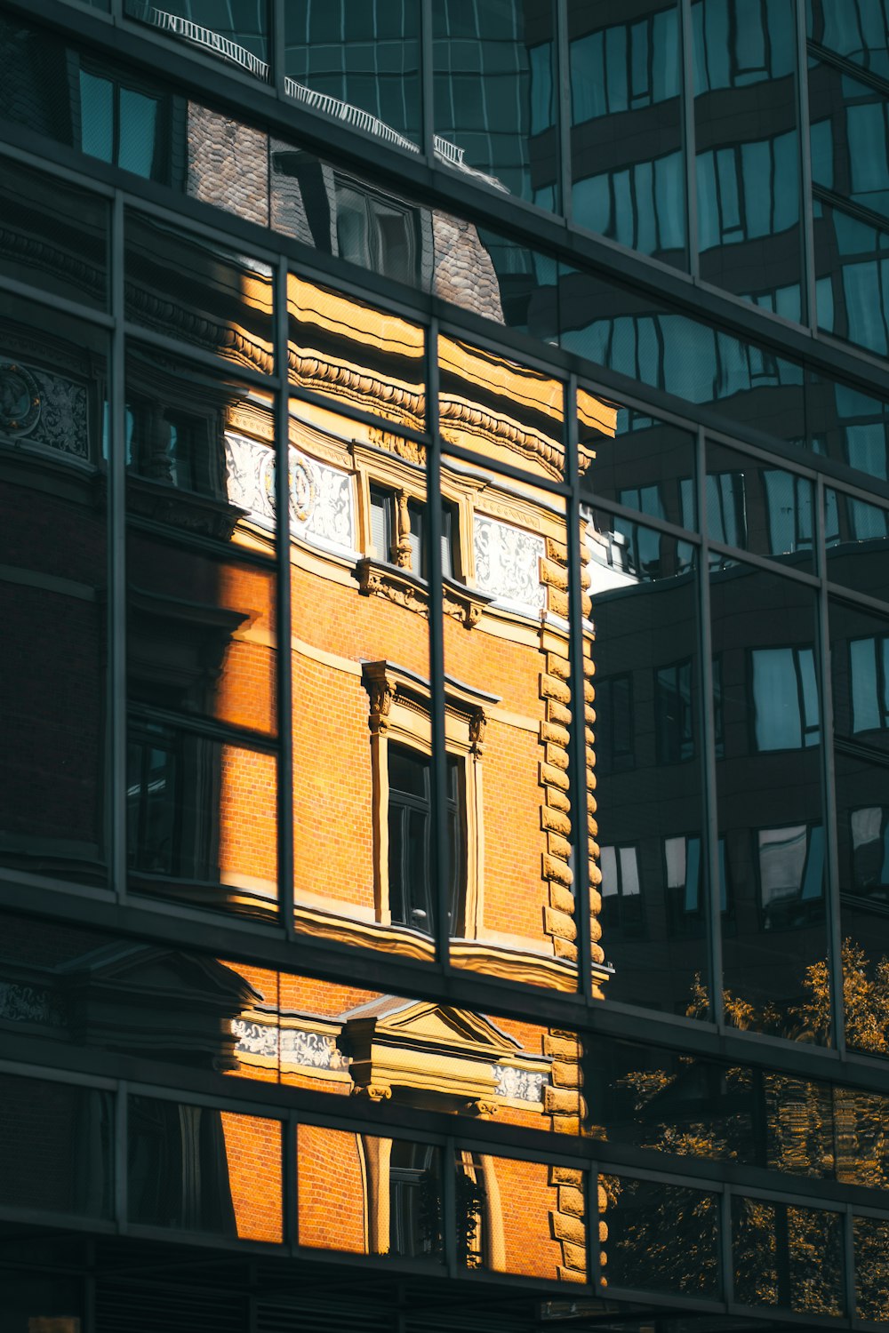 a reflection of a building in a glass building