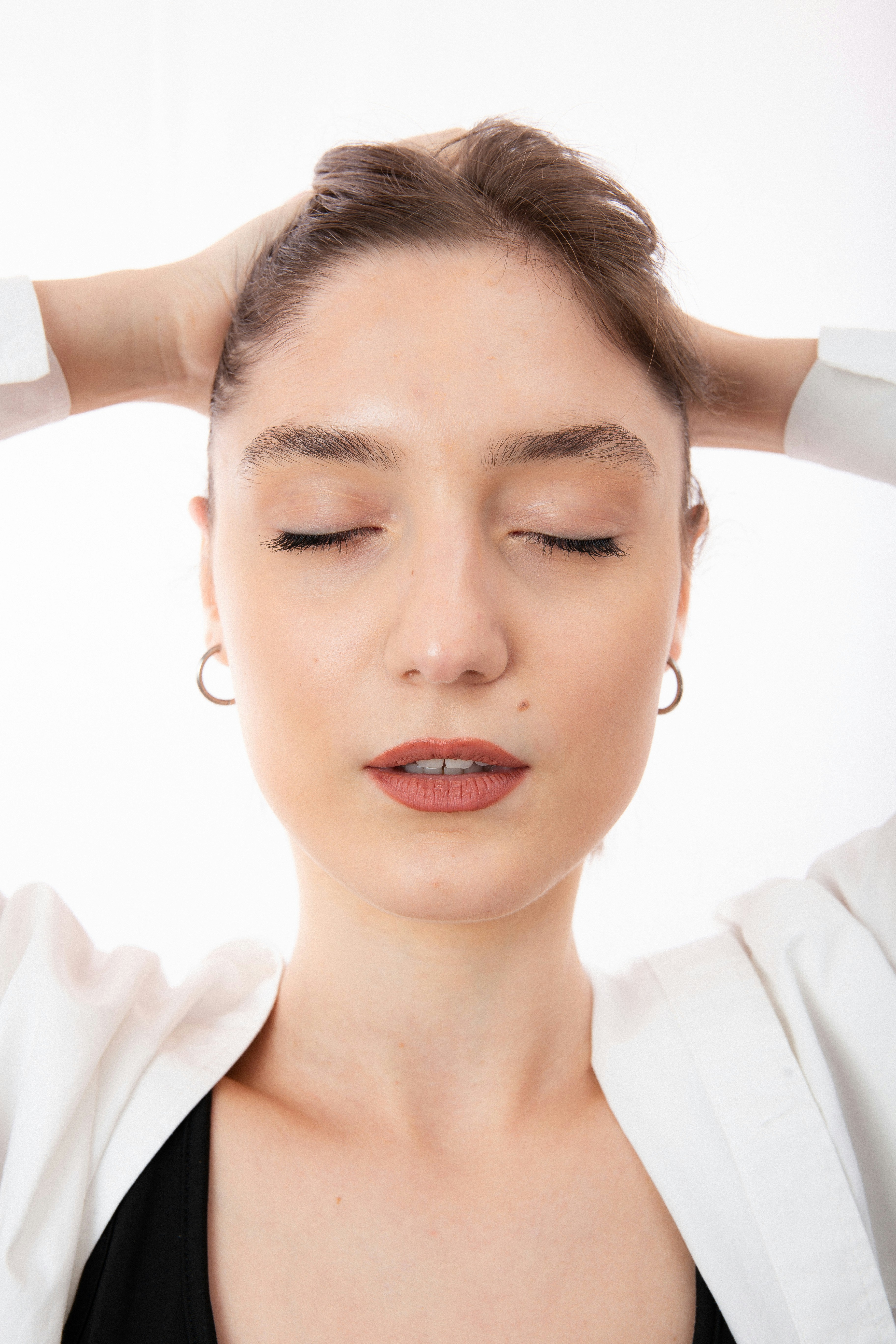 Woman with a headache contemplating nootropic side effects