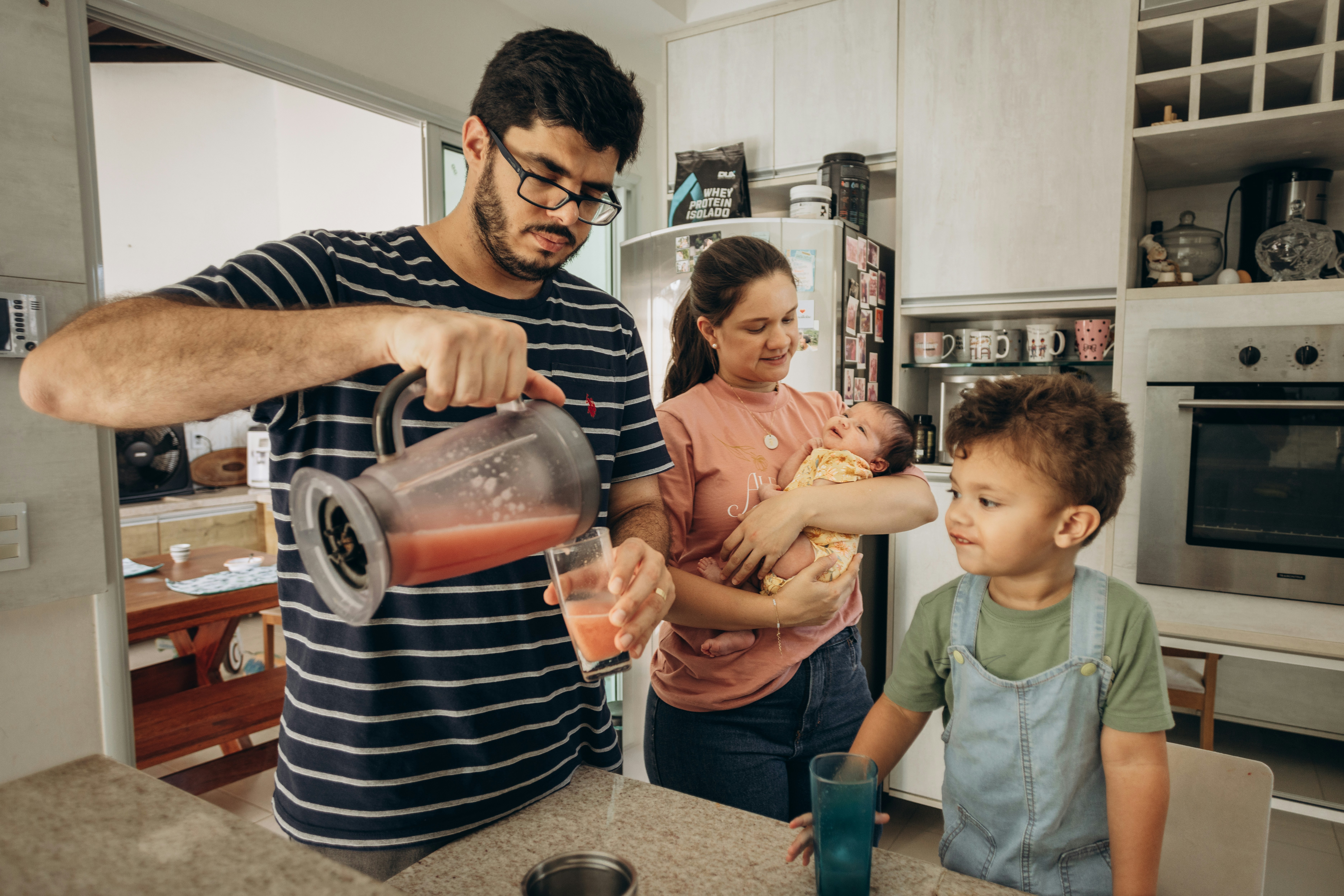 happy family using a water dispenser connected to an RO system - reverse osmosis pfas removal