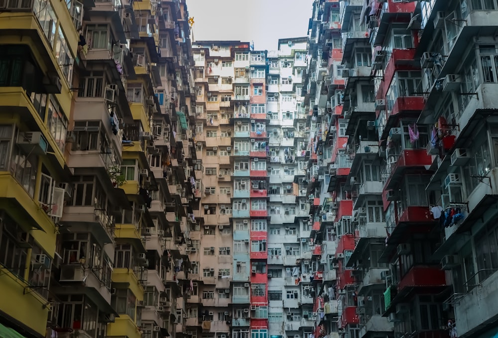 a group of tall buildings with balconies on them