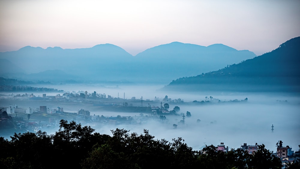 a view of a city with mountains in the background