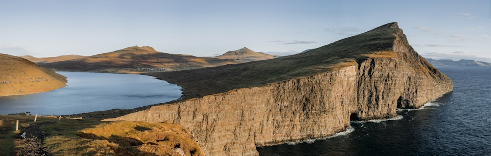 a large rock formation in the middle of a body of water