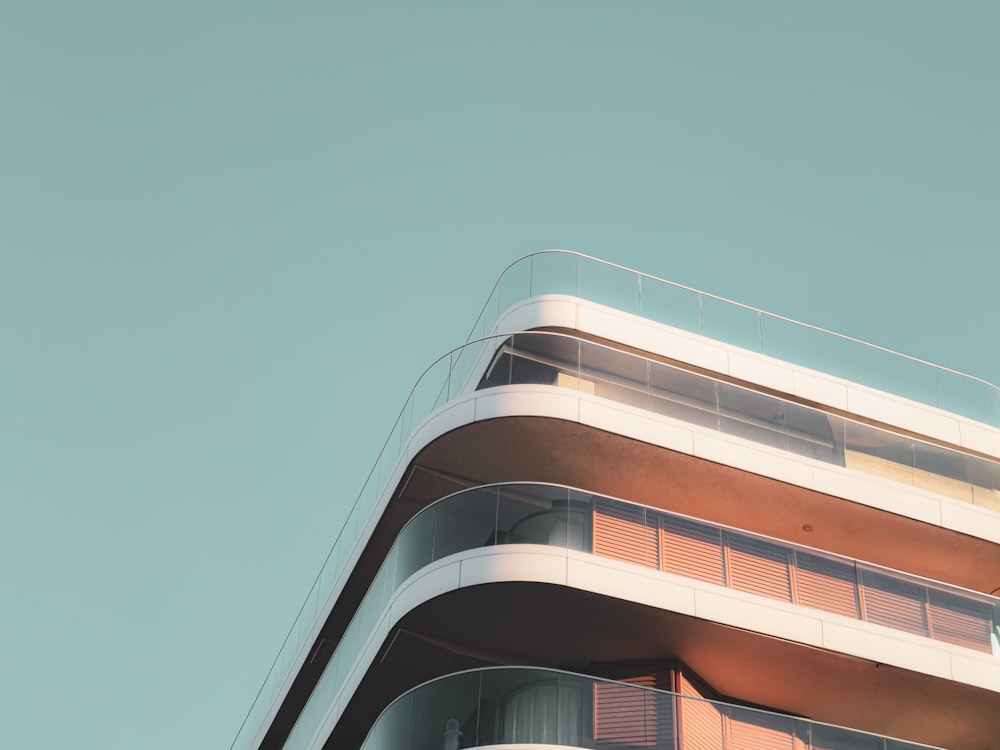 a tall building with balconies on top of it