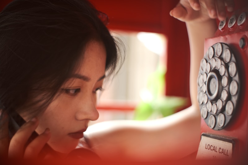 Stylish Japanese woman by red wall