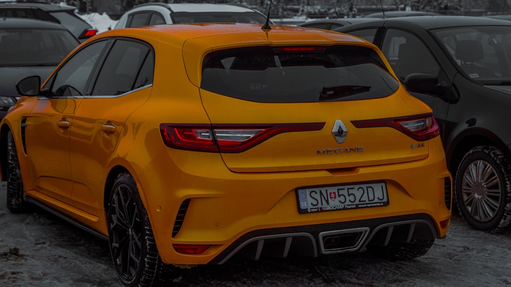 a yellow car parked in a parking lot