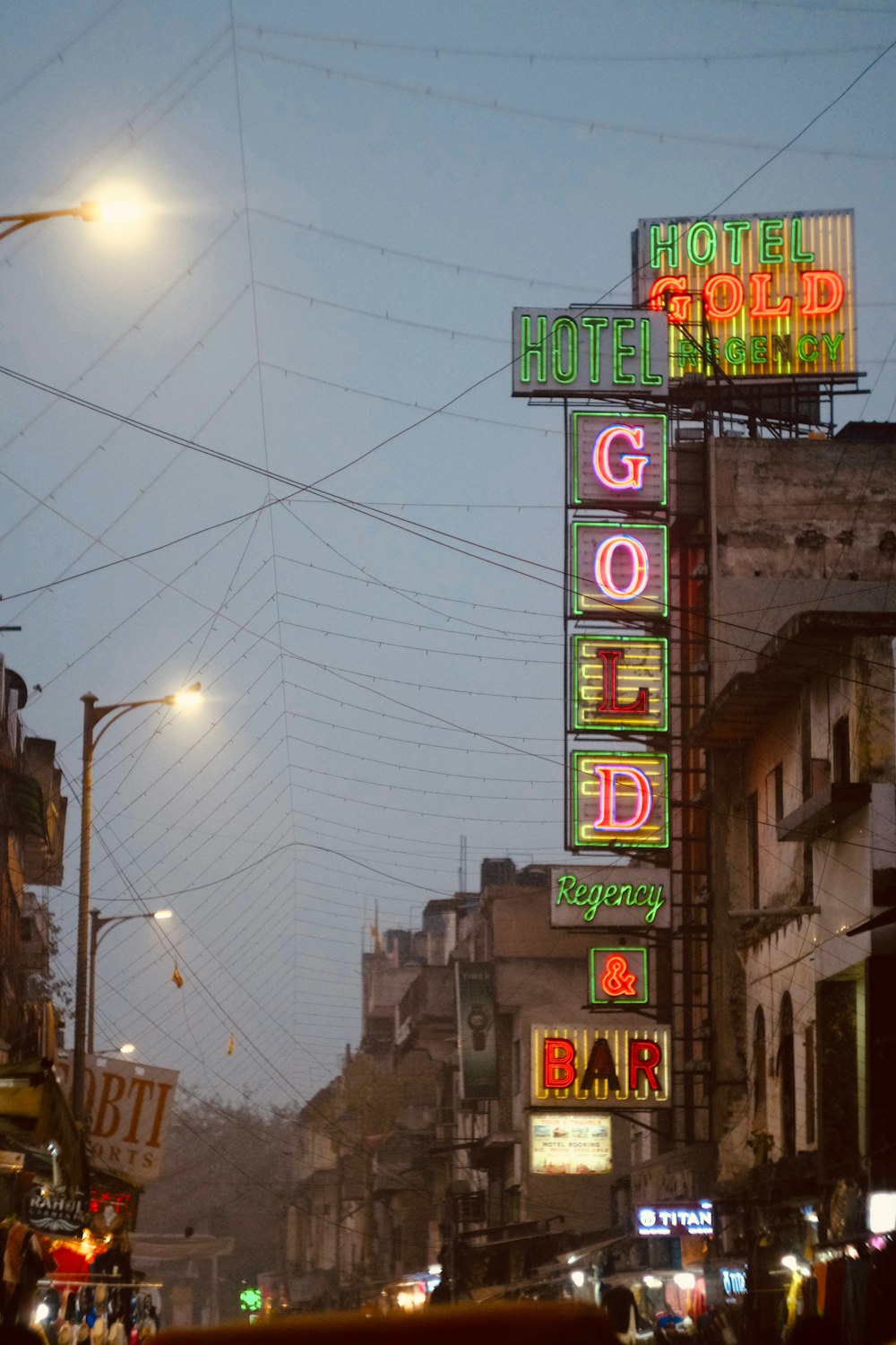 a large neon sign on the side of a building