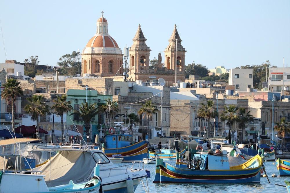 a group of boats floating on top of a body of water