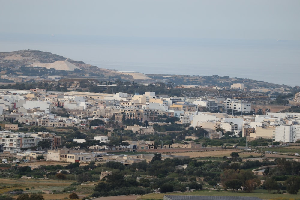 a view of a city with a hill in the background