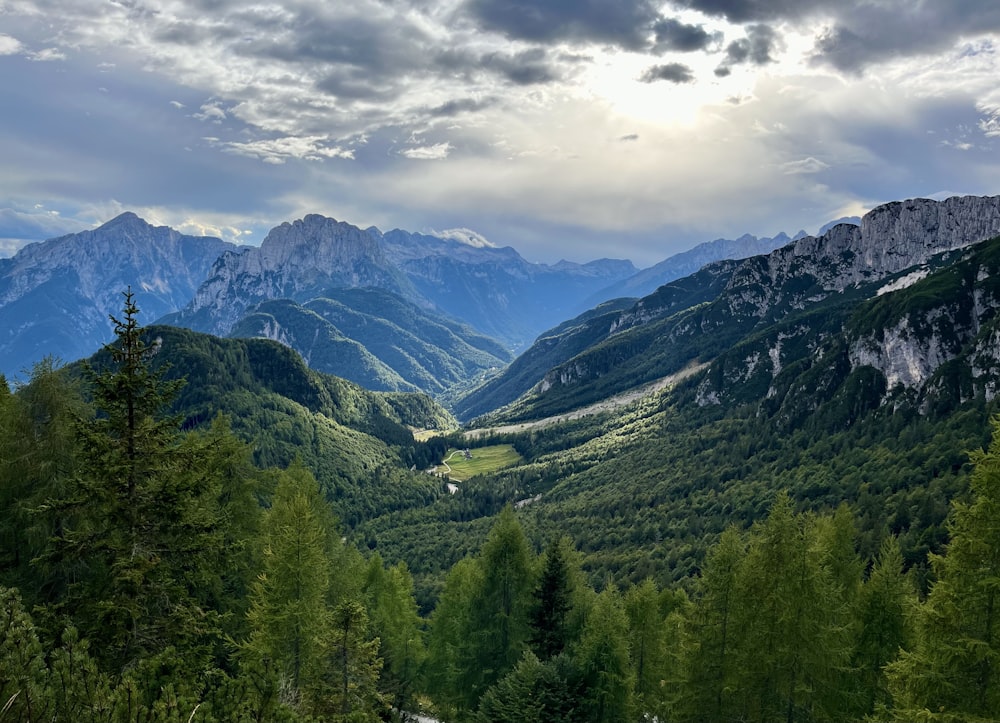 a view of a valley with mountains in the background