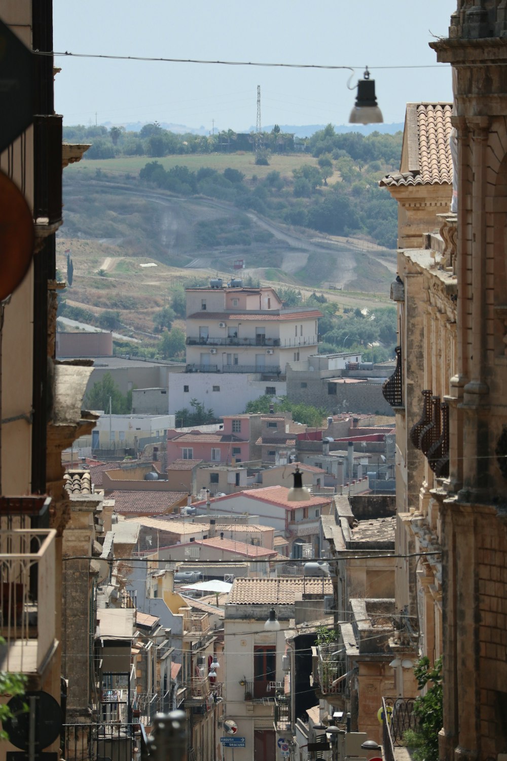 a view of a city from an alley way