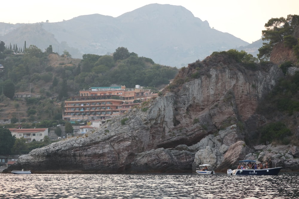 a group of boats floating on top of a body of water