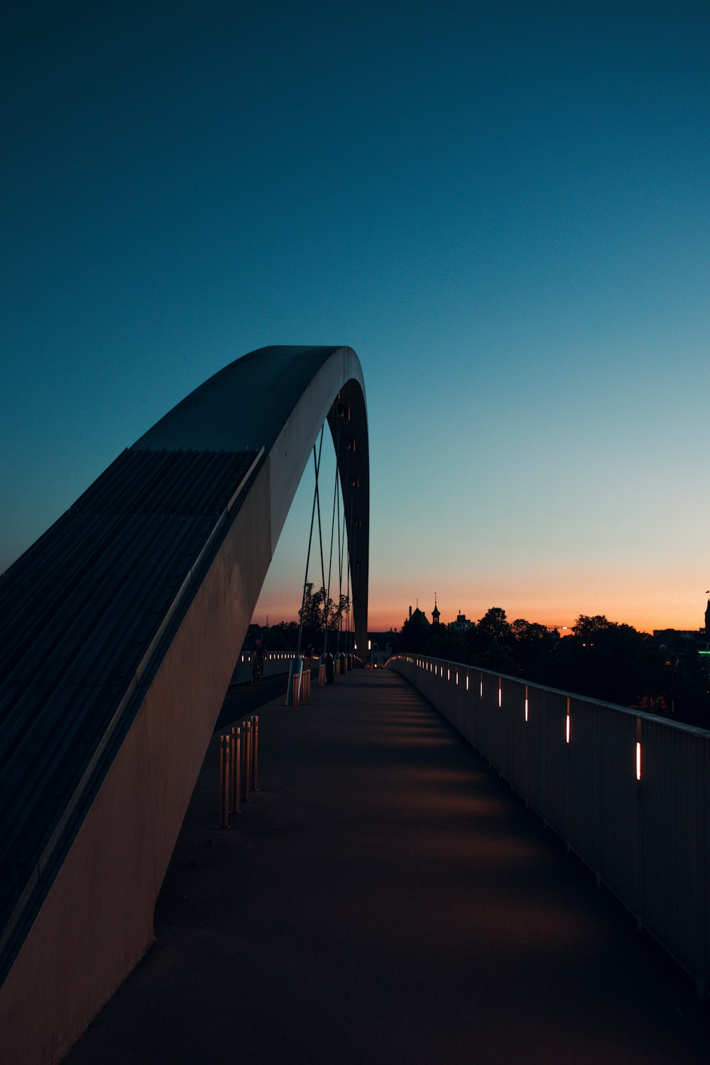 a bridge with a sky in the background