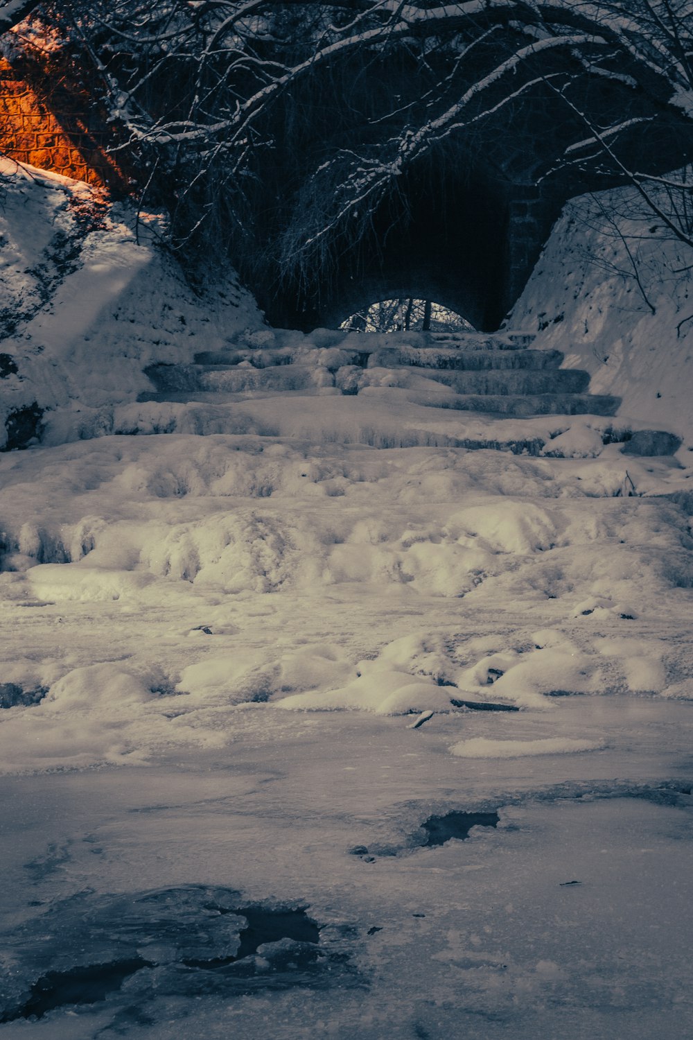 a man riding skis down a snow covered slope