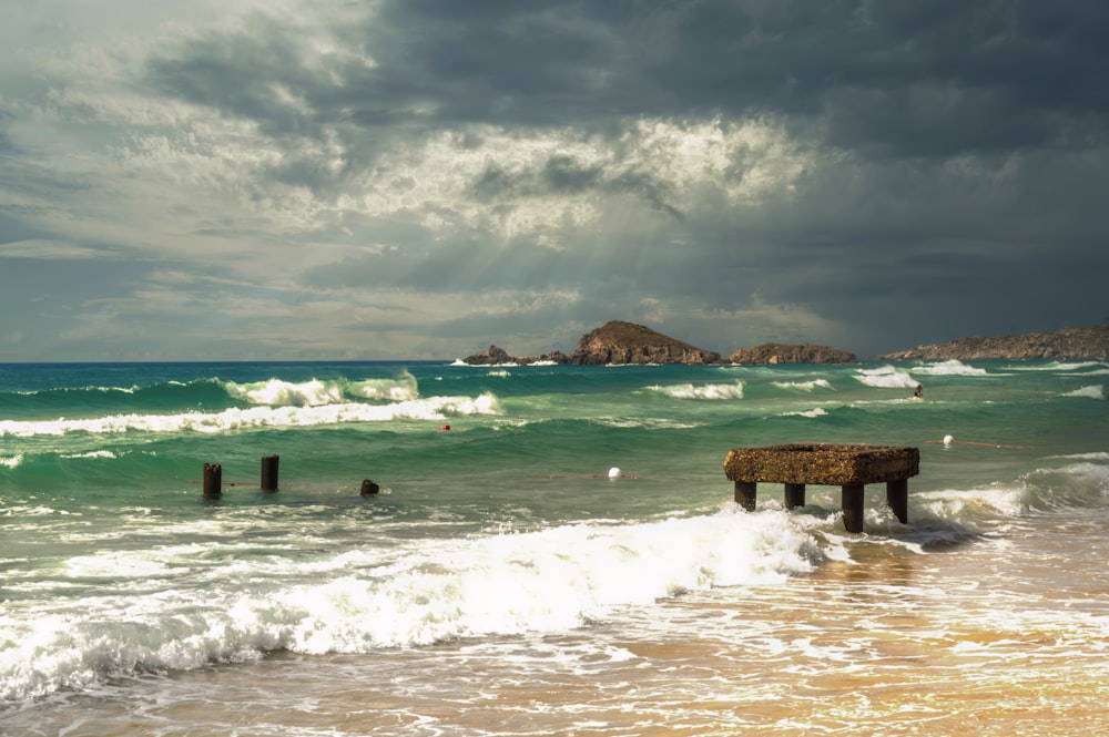 a body of water with waves coming in to shore