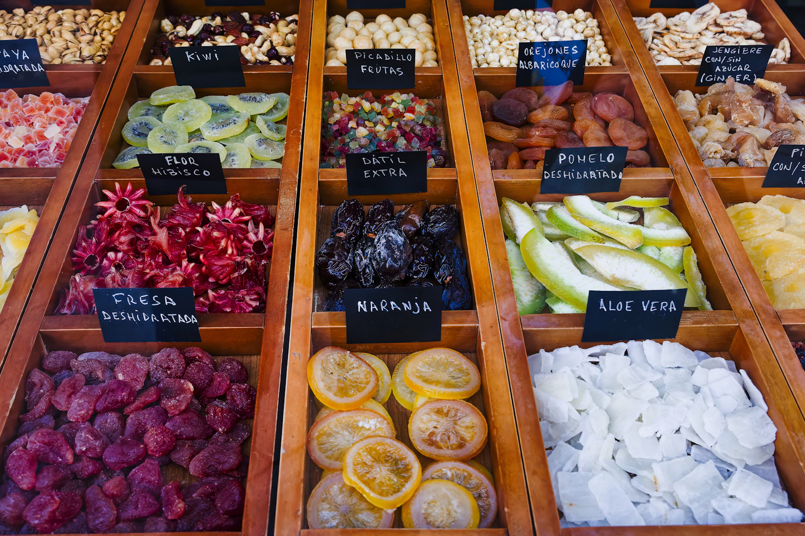 Wooden crates of dried fruit and produce with handwritten labels