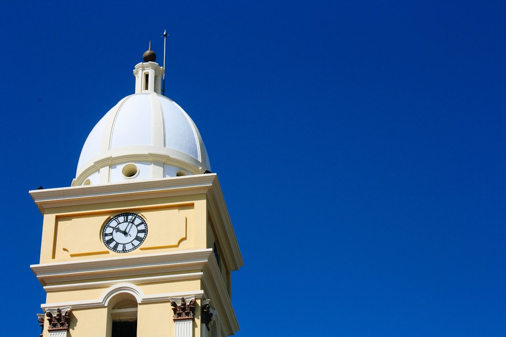 a clock tower with a sky background