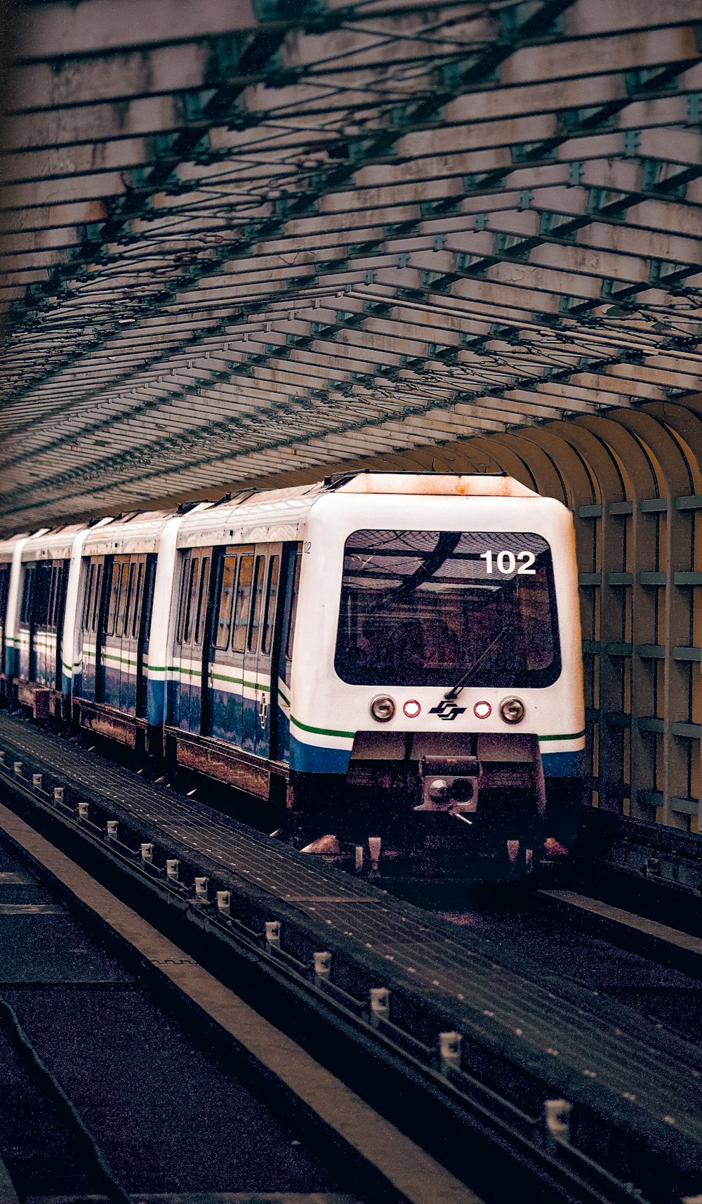 a train on a track in a train station