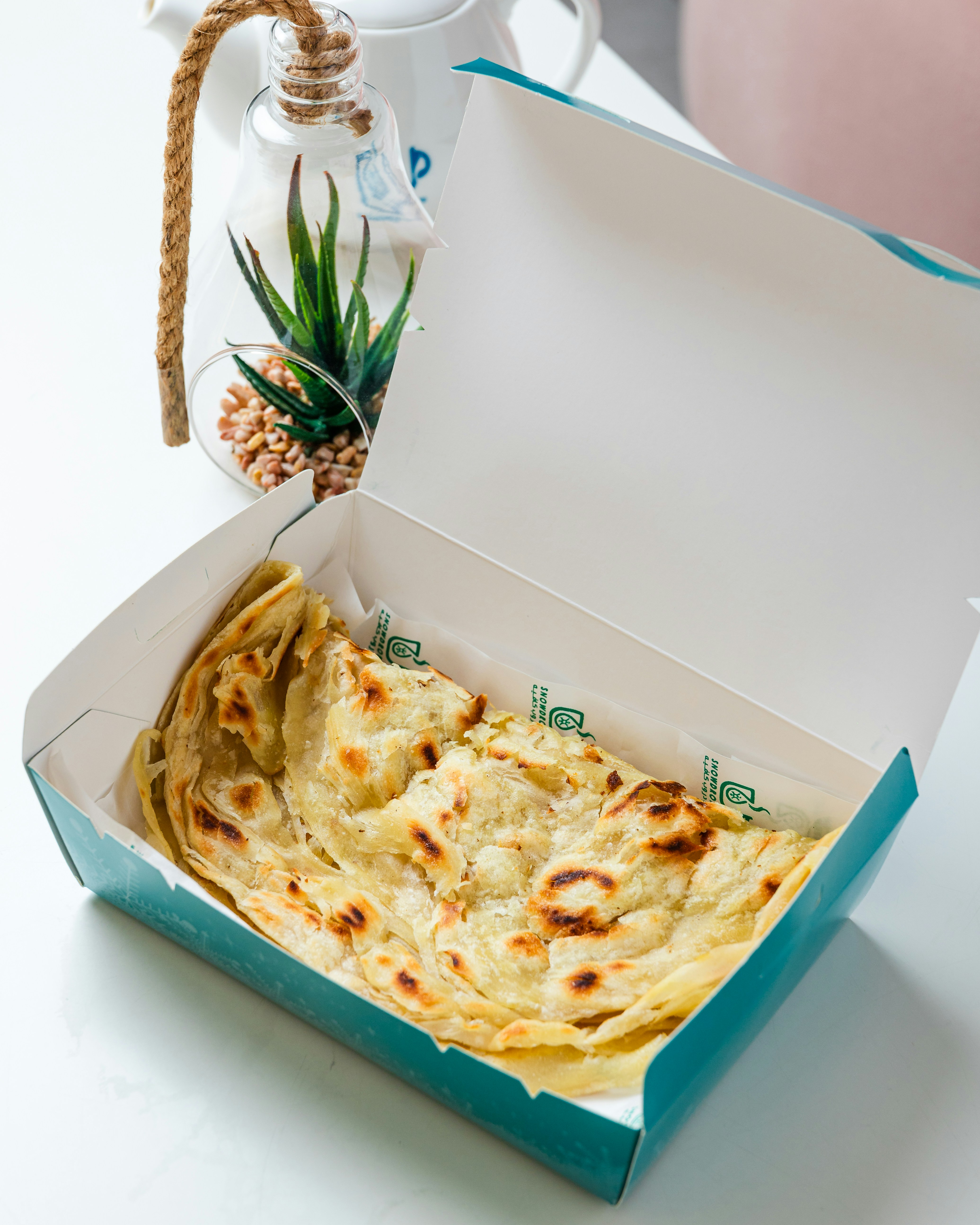 a box of flat bread sitting on a table