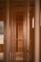 a room that is under construction with wooden framing