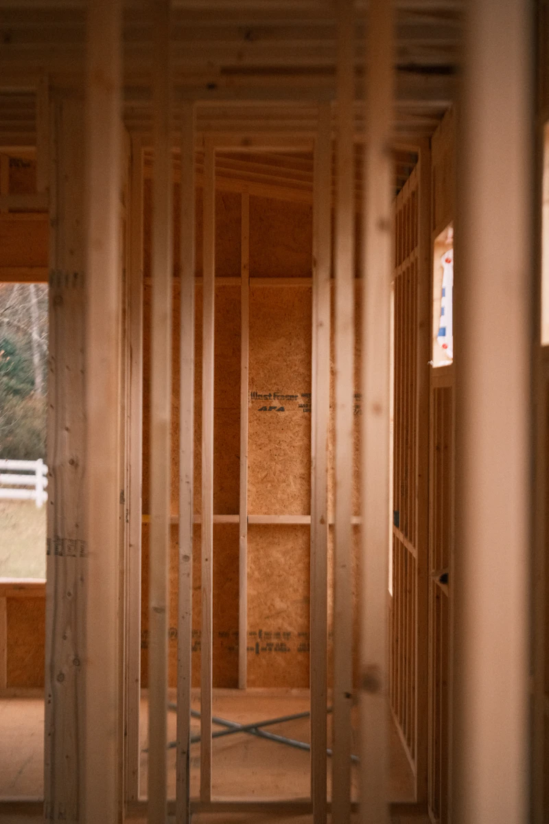 Drywall contractor reviewing job schedule across multiple sites