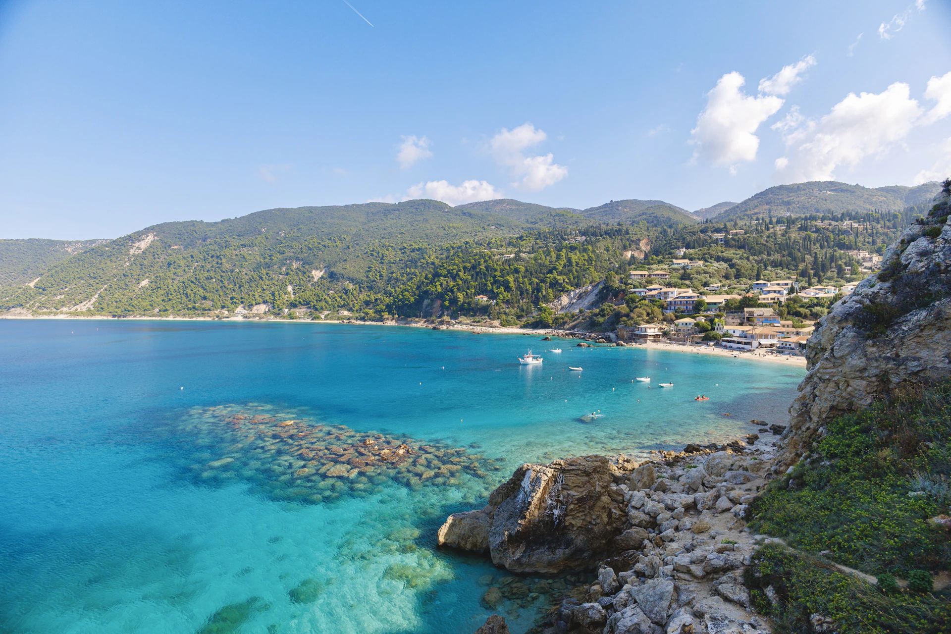 a view of a beach with boats in the water