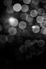 a black and white photo of a street light