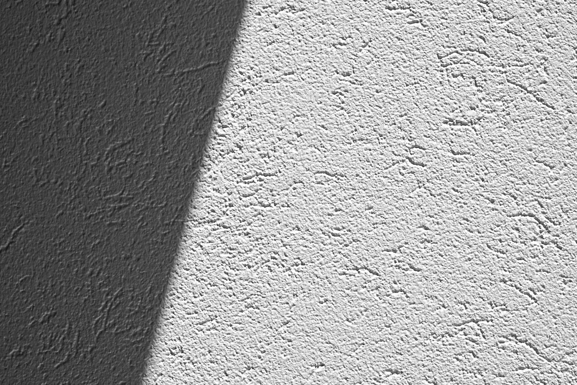 a shadow of a person standing in front of a wall