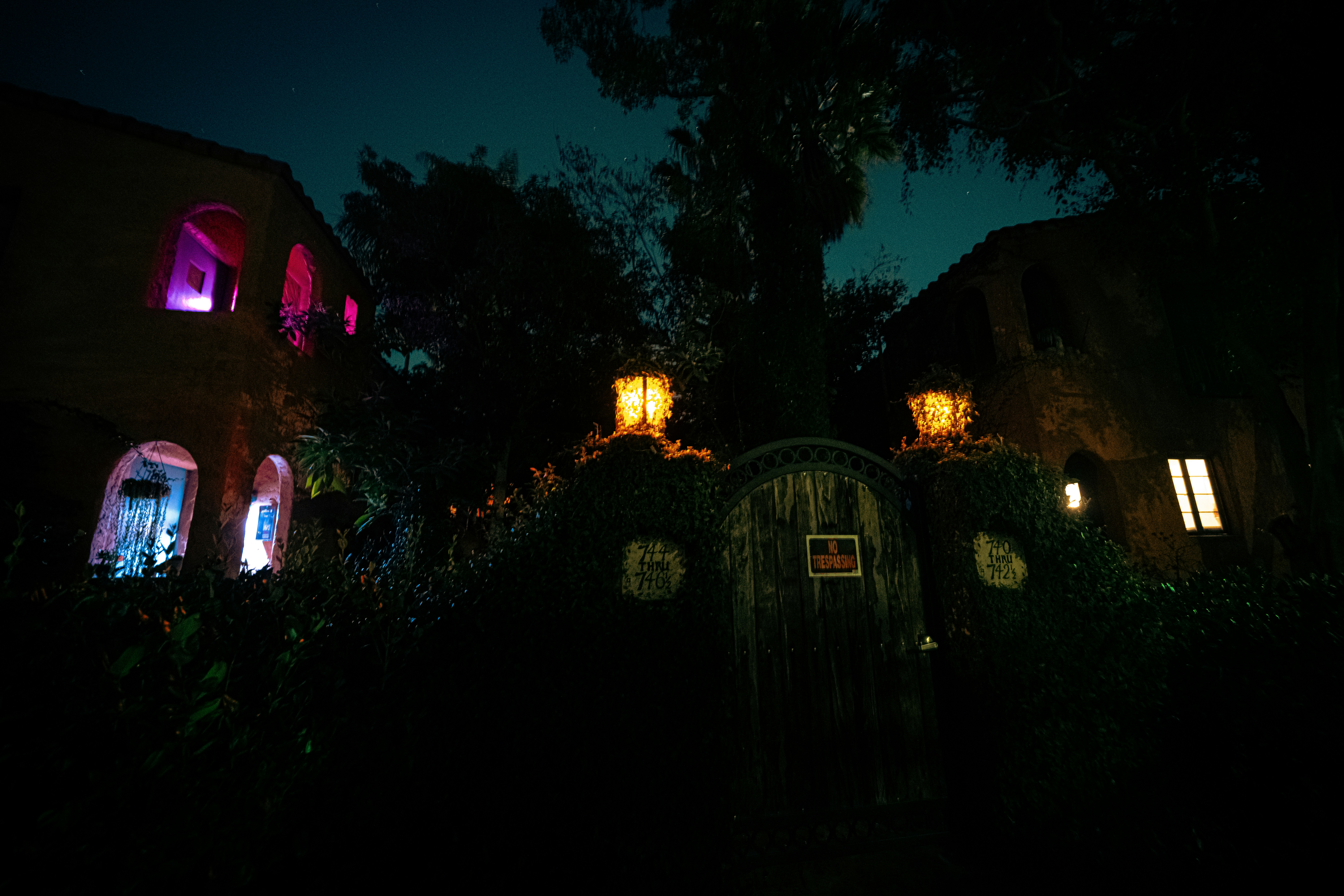 A house is lit up at night with colorful lights photo – Free Color ...