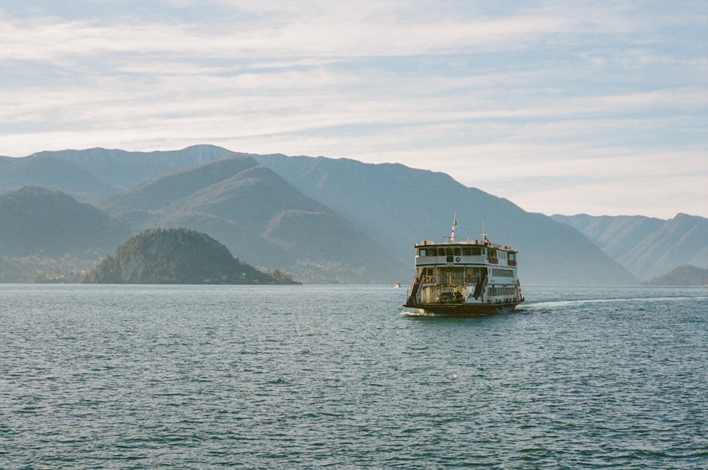 a boat is traveling on a large body of water