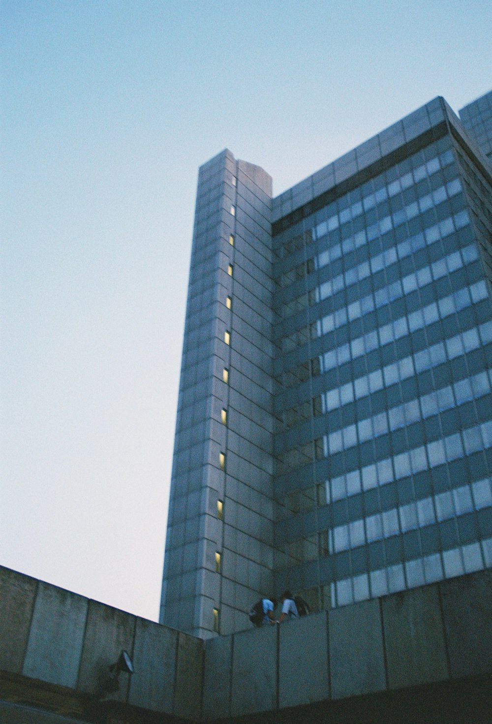 a tall building sitting next to a tall building