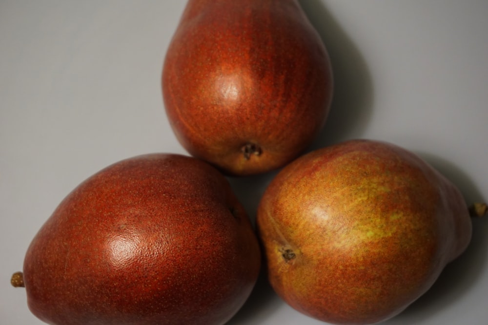 three pieces of fruit sitting on top of each other