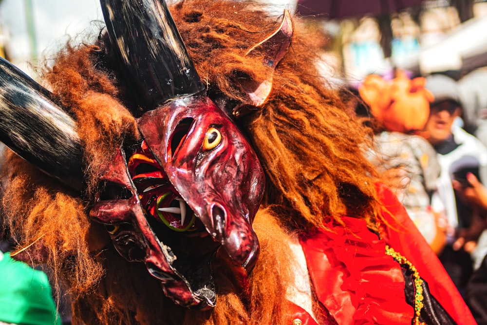 a group of people wearing masks and costumes