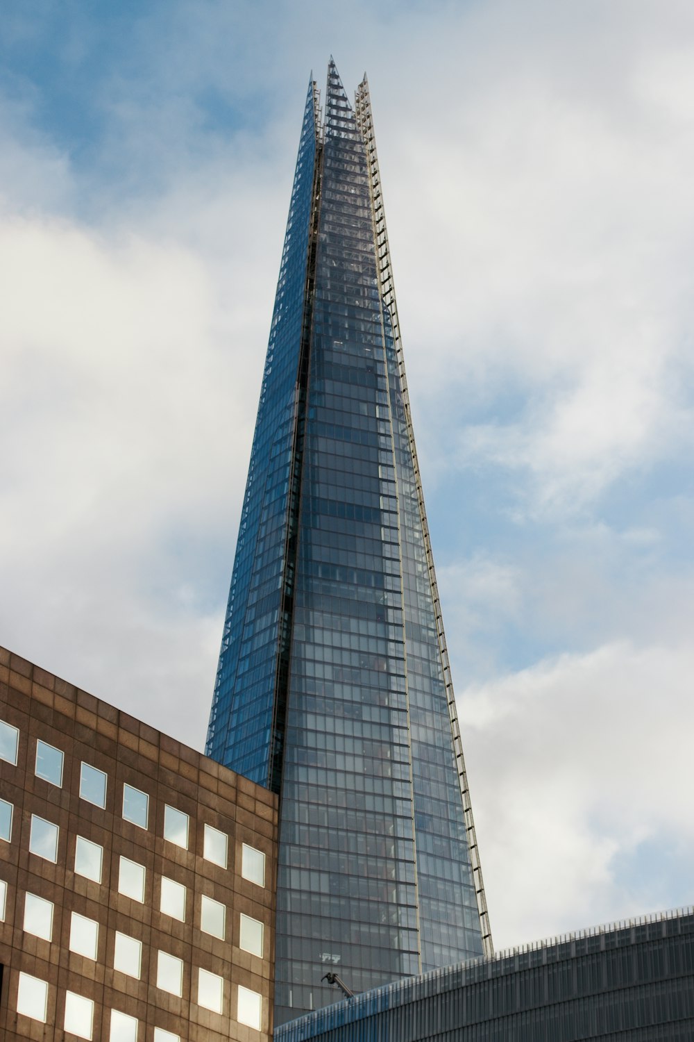 a very tall building next to a very tall building