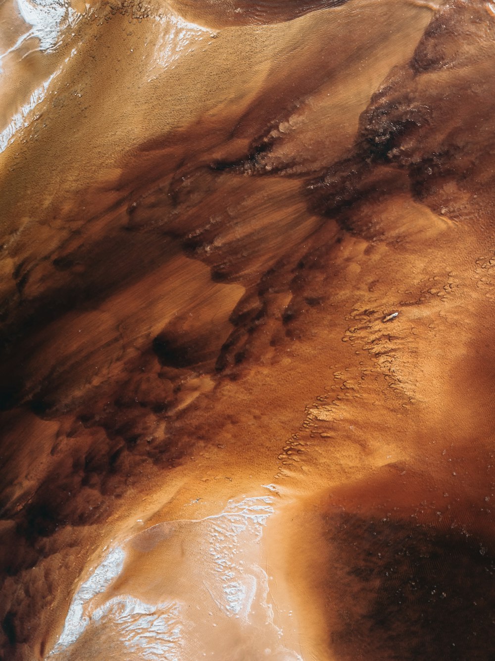a close up of a brown substance on a surface