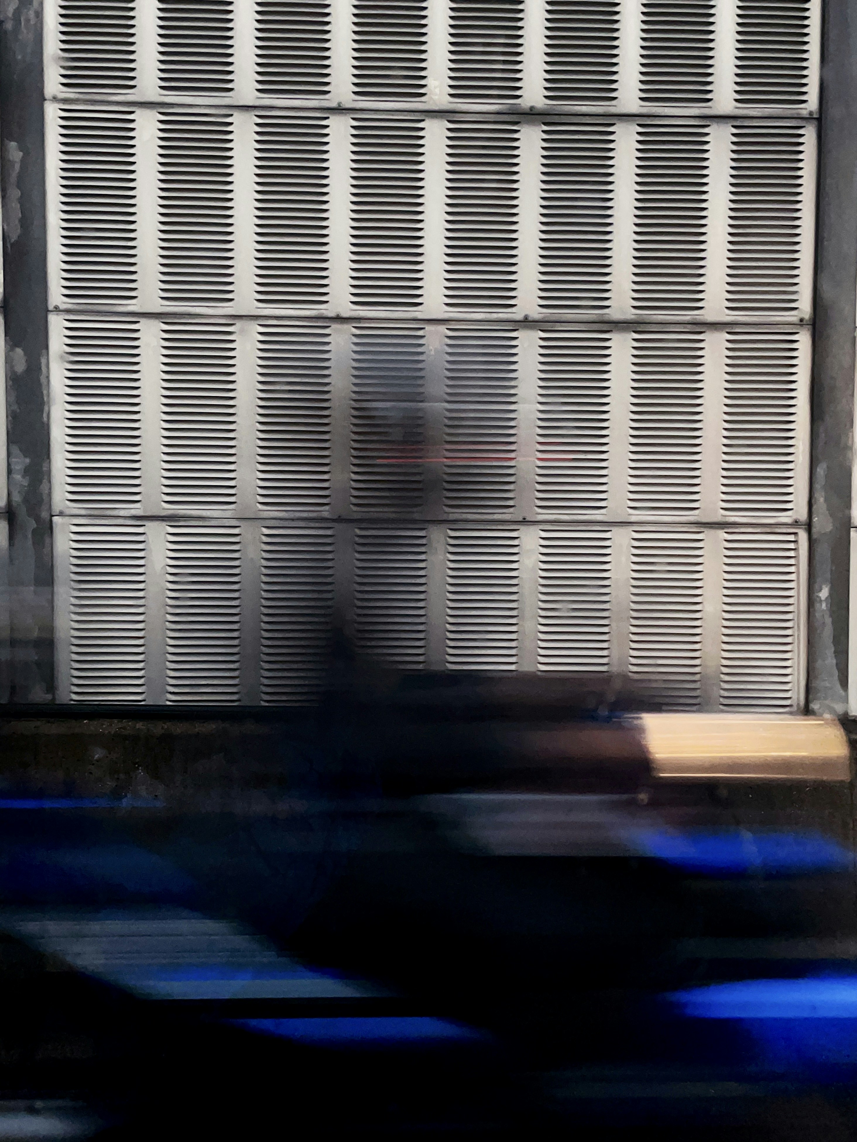 a blurry photo of a person sitting on a bench