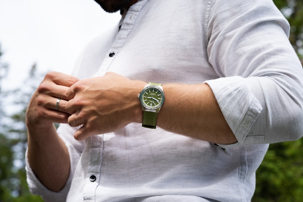 a man with a watch on his wrist